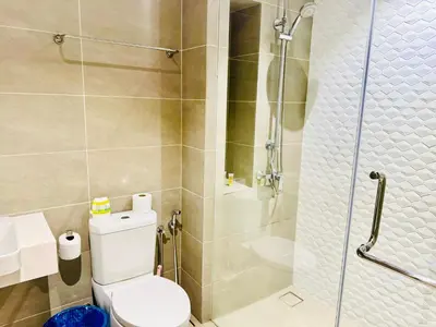 a bathroom with a toilet and a shower at Majestic Suites KLCC in Kuala Lumpur