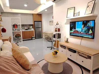 a living room with a couch and a tv at Agile Residence Dual-Key Gem Bukit Bintang by Natol Chain of Homestays in Kuala Lumpur