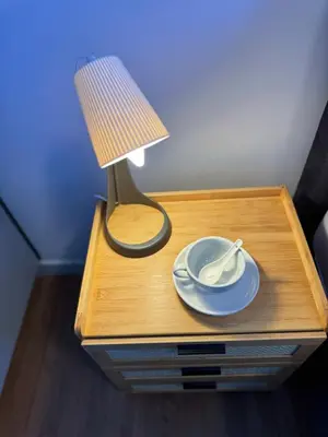 a table with a lamp and a plate on it at M Vertica Cheras KL City Fully Air-Con Nice View Home in Kuala Lumpur