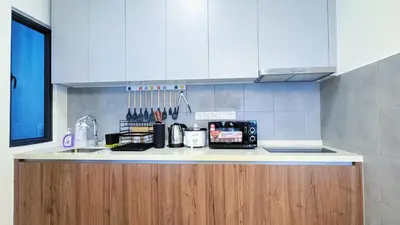 a kitchen with a counter with a coffee maker on it at M Vertica Cheras KL City Fully Air-Con Nice View Home in Kuala Lumpur