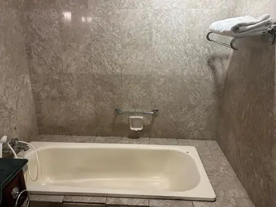 a bath tub in a bathroom with a sink at PERFECT SUITE at TIMES SQUARE KL in Kuala Lumpur