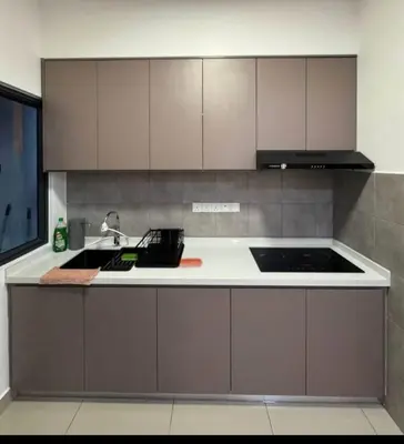 a kitchen with a sink and a counter top at Cozy Room in Kuala Lumpur