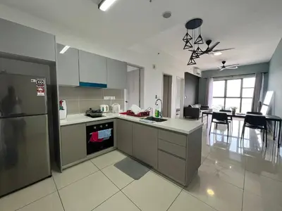 a kitchen with a refrigerator and a counter top at Trion KL By Luxe Home in Kuala Lumpur