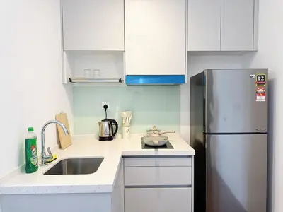 a kitchen with a sink and a refrigerator at Cozy Studio l Riveria City l 1km to KL Sentral in Kuala Lumpur