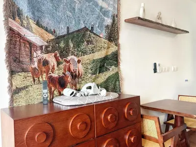 a dresser in a room with a painting on the wall at Cozy Studio l Riveria City l 1km to KL Sentral in Kuala Lumpur
