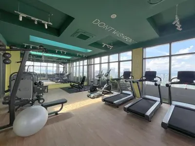 a gym with treadmills and exercise equipment in a building at Cozy Studio l Riveria City l 1km to KL Sentral in Kuala Lumpur