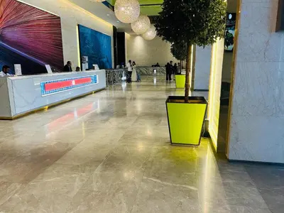 a lobby with a potted tree in the middle of a building at PLATINUM SUITE by KUALALUMPUR MALAYSIA in Kuala Lumpur