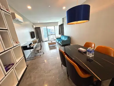 a dining room with a table and chairs and a desk at PLATINUM SUITE by KUALALUMPUR MALAYSIA in Kuala Lumpur