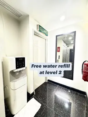 a bathroom with a water return at level at Central City Hotel at Chinatown in Kuala Lumpur