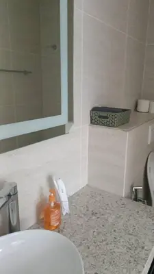 a bathroom with a sink and a mirror at Star Residence Klcc By Stellar Inn in Kuala Lumpur