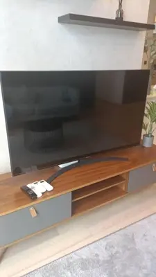a flat screen tv sitting on top of a entertainment center at Star Residence Klcc By Stellar Inn in Kuala Lumpur