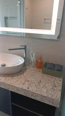a bathroom counter with a sink and a mirror at Star Residence Klcc By Stellar Inn in Kuala Lumpur