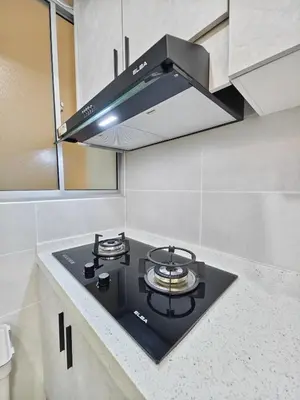 a black stove top oven in a kitchen at AimanDamia Homestay Setapak II in Kuala Lumpur