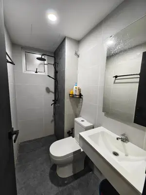 a bathroom with a white toilet and a sink at AimanDamia Homestay Setapak II in Kuala Lumpur