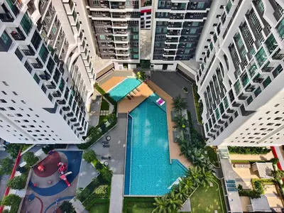 an overhead view of a pool between two buildings at AimanDamia Homestay Setapak II in Kuala Lumpur