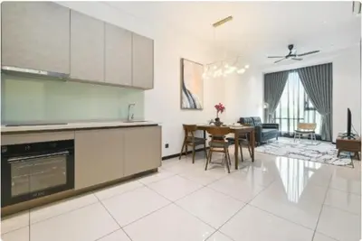 a kitchen and living room with a table and chairs at Opus Residence by Cloud Escape in Kuala Lumpur