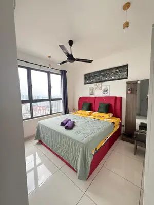 a bedroom with a large bed and a ceiling fan at Cozy kenwingston platz kl 2-5pax 2BR&2BR Klcc view with free parkin 4305 in Kuala Lumpur