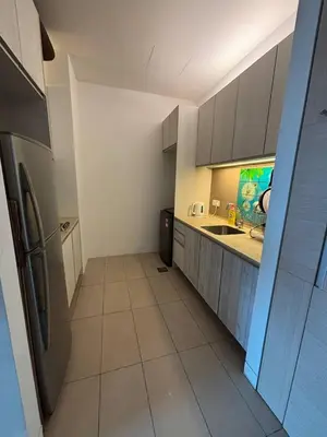 a kitchen with a sink and a refrigerator at SG Residence by Lush Living in Kuala Lumpur