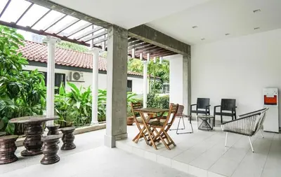 a patio with a table and chairs on it at 68 Palms 01 l Midvalley l KL Sentral l 5 Pax in Kuala Lumpur