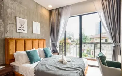 a bedroom with a bed and a large window at 68 Palms 01 l Midvalley l KL Sentral l 5 Pax in Kuala Lumpur