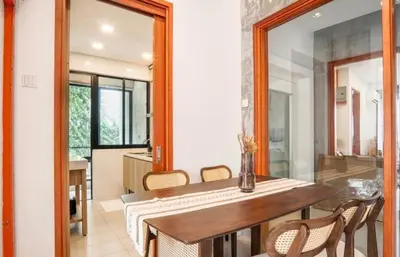 a dining room with a table and chairs and a mirror at 68 Palms 01 l Midvalley l KL Sentral l 5 Pax in Kuala Lumpur