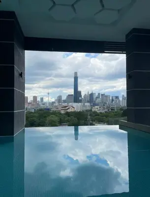 a view of a city skyline from a swimming pool at Lavile Homestay in Kuala Lumpur