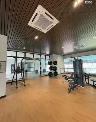 a gym with treadmills and exercise equipment in a room at Lavile Homestay in Kuala Lumpur