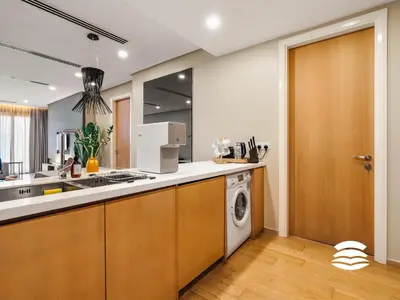 a kitchen with a washer and dryer in it at 188 Suites KLCC by Soulasia in Kuala Lumpur