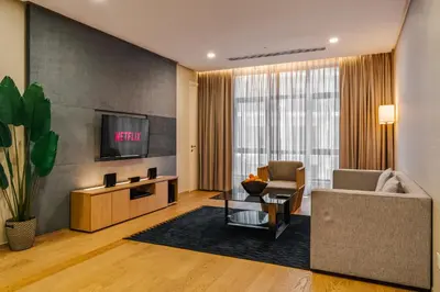 a living room with a couch and a tv at 188 Suites KLCC by Soulasia in Kuala Lumpur