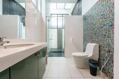 a bathroom with a toilet and a sink and a shower at Flame of the Forest Retreat 38Pax 8R7B Pool Villa Kuala Lumpur in Kuala Lumpur