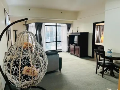 a living room with a net hanging over a couch at Times Square by Perfect in Kuala Lumpur