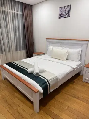 a bedroom with a large white bed with white pillows at Vortex Suites klcc City Malaysia in Kuala Lumpur