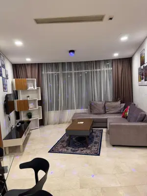 a living room with a couch and a table at Vortex Suites klcc City Malaysia in Kuala Lumpur