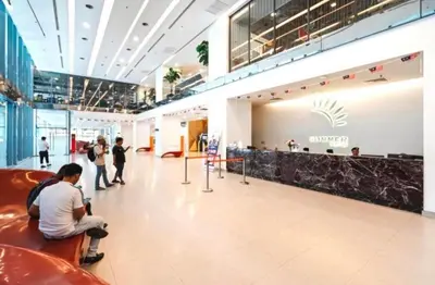 a lobby of a shopping mall with people sitting at Summer Hotel and Condo Suites Nearby KLCC Area in Kuala Lumpur