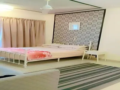 a bedroom with a bed with a large headboard at PV21 Luxe Comfort 3 Bedroom Modern Homestay in Prime Location near Setapak Central Mall in Kuala Lumpur