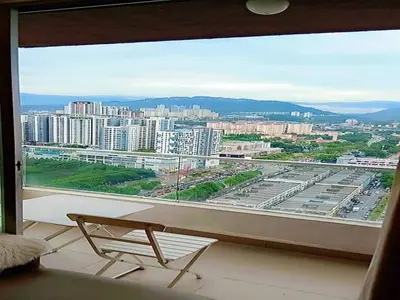 a view of a city from a large window at PV21 Luxe Comfort 3 Bedroom Modern Homestay in Prime Location near Setapak Central Mall in Kuala Lumpur