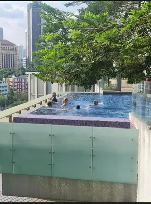 a group of people in a swimming pool on a building at Robertson Residence Main City Kuala Lumpur in Kuala Lumpur