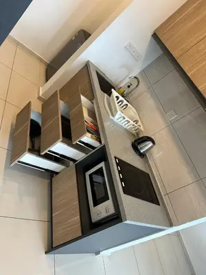 an overhead view of a kitchen with a tv and shoes at Robertson Residence Main City Kuala Lumpur in Kuala Lumpur