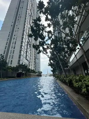 a swimming pool in a city with tall buildings at Robertson Residence Main City Kuala Lumpur in Kuala Lumpur