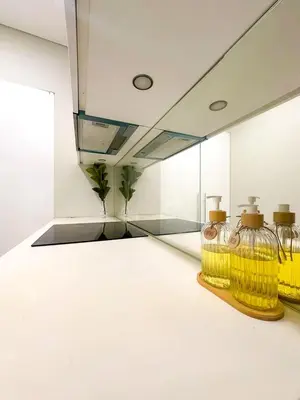 a room with three wine glasses on a table at Modern Condo Next To Petronas Towers in Kuala Lumpur