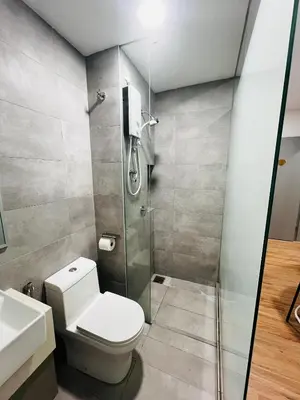 a bathroom with a toilet and a shower at Nest Heaven Host in Kuala Lumpur