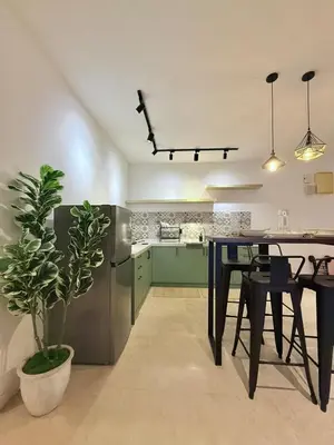 a kitchen with a table and a potted plant at VibeHaus 11px 2R2B Pavillion Bukit Bintang 1mins in Kuala Lumpur