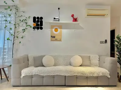 a living room with a white couch in a room at VibeHaus 11px 2R2B Pavillion Bukit Bintang 1mins in Kuala Lumpur