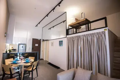 a dining room and kitchen with a table and chairs at Bangsar LRT Suites EST by LSA in Kuala Lumpur