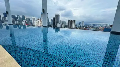 a swimming pool on top of a city skyline at The Thant Suite in Kuala Lumpur
