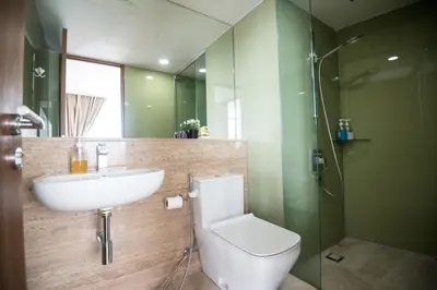 a bathroom with a toilet and a sink and a shower at Vortex KLCC by LSA in Kuala Lumpur
