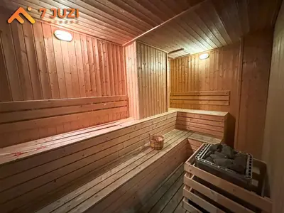 an empty wooden sauna with a stove in it at Klcc Quill Cozy& Chill Suite 3-5Pax HD1080 Netflix in Kuala Lumpur