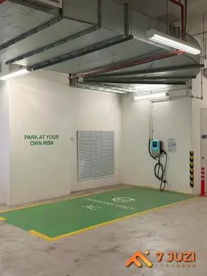 a parking lot with a green floor in a garage at Klcc Quill Cozy& Chill Suite 3-5Pax HD1080 Netflix in Kuala Lumpur