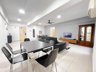 a living room with a table and chairs at Fahrenheit 88 Bukit Bintang by Manhattan Group in Kuala Lumpur