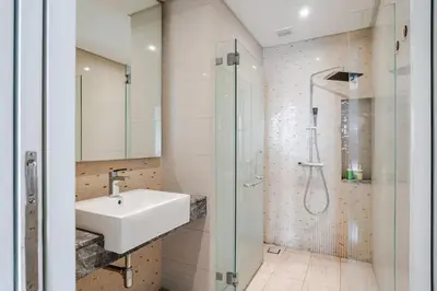 a bathroom with a sink and a shower at Designer Luxury Condo Near Bukit Bintang in Kuala Lumpur